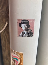 a sticker with a picture of a woman on it