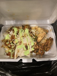 an indian meal in a plastic container