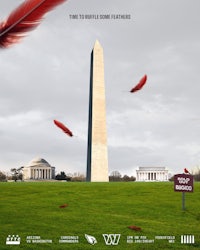 the washington monument with red feathers in the background